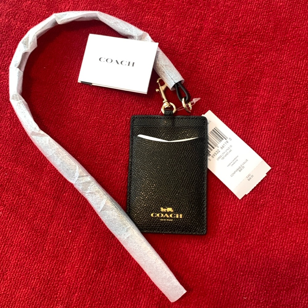Black and gold Coach lanyard